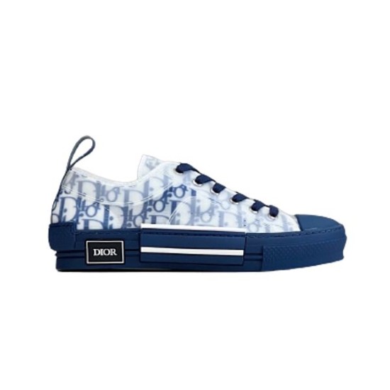 Side view of Dior B23 low-top trainers in blue oblique canvas on a plain background