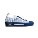 Isolated side view of Dior B23 low-top trainer in blue oblique canvas
