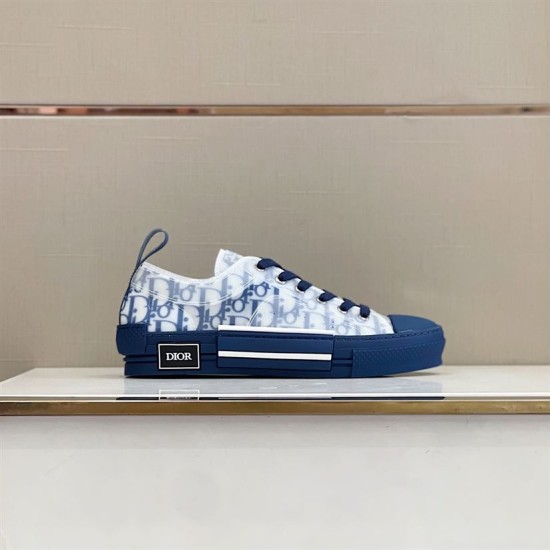 Profile view of Dior B23 blue low-top trainers displayed on a shelf