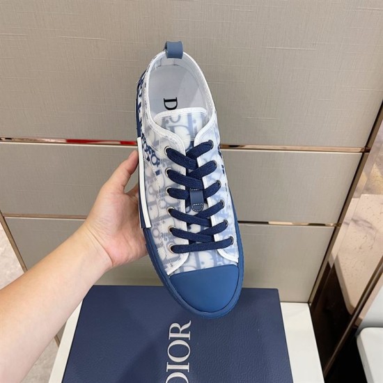 Overhead view of a single Dior B23 low-top trainer showing navy laces and collar in blue