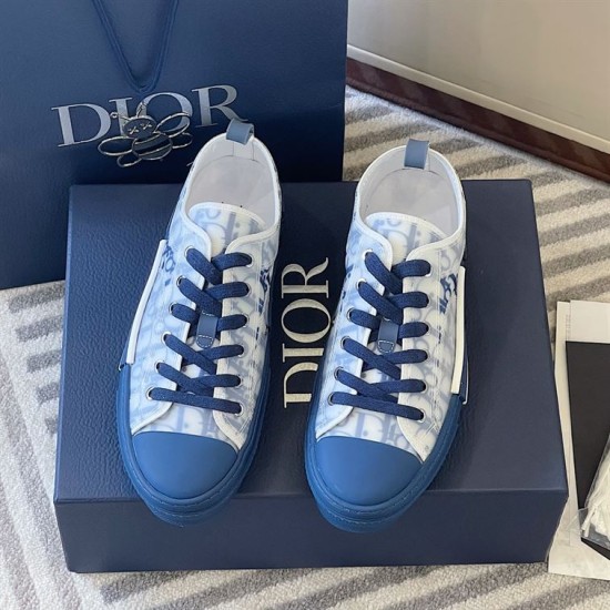 Front elevated view of Dior B23 blue oblique trainers positioned on a box
