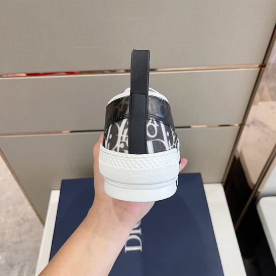 Dior B23 Low Top Black Monogram Canvas Trainer Heel View in black and white Rear heel view of Dior B23 Low Top Black Monogram Canvas Trainer with pull tab in black and white