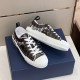 Dior B23 Low Top Black Monogram Canvas Trainers Box Display in black and white Dior B23 Low Top Black Monogram Canvas Trainers arranged side by side on blue box in black and white