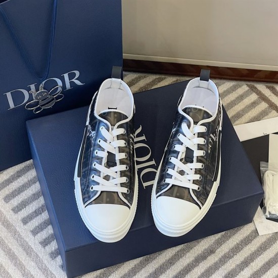 Dior B23 Low Top Black Monogram Canvas Trainers Pair View in black and white Dior B23 Low Top Black Monogram Canvas Trainers pair presented on blue shoe box in black and white