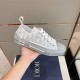 Dior B23 Low Top Grey Oblique Canvas Trainers Handheld View Handheld view showcasing side detail and lace-up design of grey oblique trainers