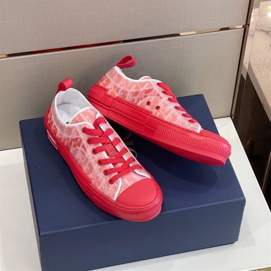 Angled side view of Dior B23 Low Top Red Oblique Canvas Trainers on box