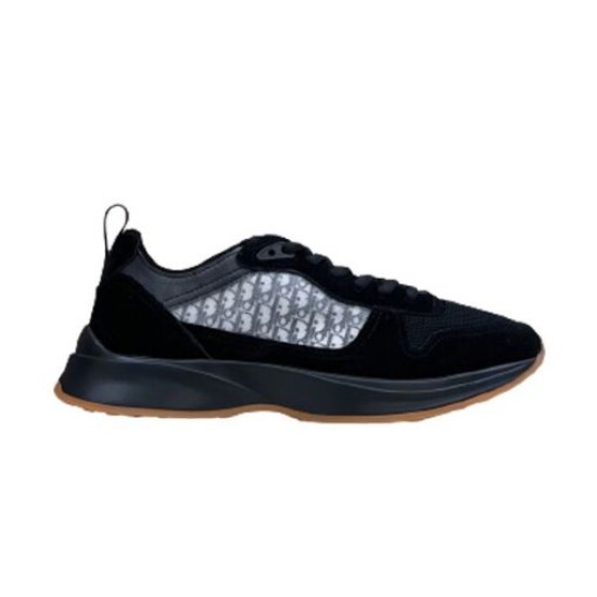 Dior B25 Runner Trainer Isolated Side Profile in black Isolated side view of Dior B25 Runner Trainer in black suede with gum sole