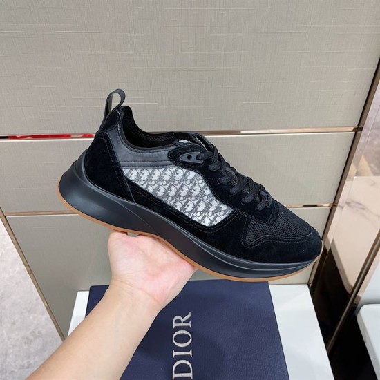 Dior B25 Runner Trainers Handheld Side View in black Handheld view of Dior B25 Runner Trainers highlighting side monogram panel in black