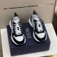 Dior B25 Runner Pair Top Front View in black and white Pair of black and white Dior B25 Runner trainers resting on branded shoe box
