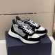 Dior B25 Runner Three-Quarter View in black and white Three-quarter front view of black and white Dior B25 Runner trainers on box