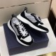 Dior B25 Runner Pair Angled View in black and white Angled view of black and white Dior B25 Runner trainers with shoe box