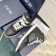 Dior B27 High-Top Black Leather Canvas Trainers Pair View Dior B27 High-Top Black Leather Canvas Trainers paired on shoe box