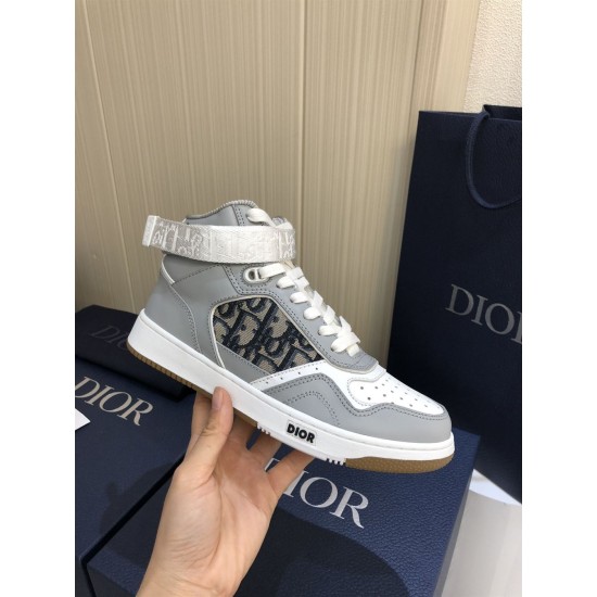 Dior B27 High-Top Grey Leather Trainer Handheld View Hand holding Dior B27 High-Top Grey Leather Trainer showing lateral side