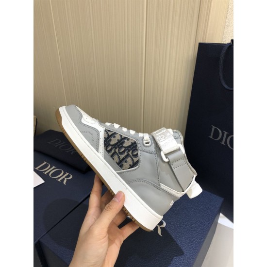 Dior B27 High-Top Grey Leather Trainer Medial View Hand holding Dior B27 High-Top Grey Leather Trainer showing medial side