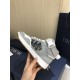 Dior B27 High-Top Grey Leather Trainer Medial View Hand holding Dior B27 High-Top Grey Leather Trainer showing medial side