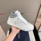 Dior High Top Leather Trainer Lateral Side Detail in white and grey Handheld lateral view highlighting oblique side panel and grey outsole accent in white and grey