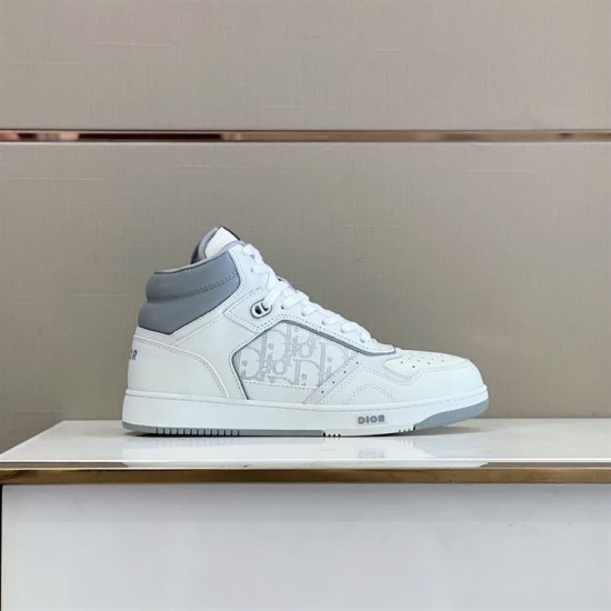Dior High Top Leather Trainer Side Profile in white and grey Side profile view of white and grey high-top trainer on display surface