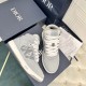 Dior B27 High-Top Grey Canvas Trainers - Pair Angle in grey and white Top-down pair view of Dior B27 high-top grey trainers resting on luxury shoe box in grey and white