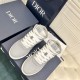 Dior B27 High-Top Grey Canvas Trainers - Overhead View in grey and white Overhead view of Dior B27 high-top grey trainers showing laces and perforated toe cap detail in grey and white