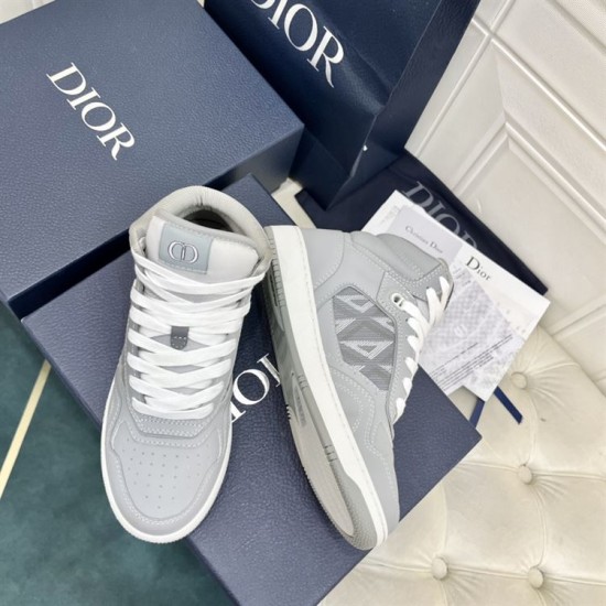 Dior B27 High-Top Grey Canvas Trainer - Front Angle in grey and white Front and side view of Dior B27 high-top grey trainer showing tongue logo badge in grey and white