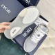 Dior B27 High-Top Grey Canvas Trainer - Rubber Sole Tread in grey and white Tread pattern on rubber sole of Dior B27 high-top grey trainer alongside front of shoe in grey and white