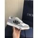 Dior B27 Low Top Grey White Canvas Low Top Trainers held up showing outer side detail and midsole logo