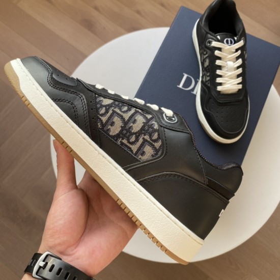 Close-up of the lateral profile of black Dior B27 trainer showcasing stitching and sole detail in black and white