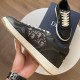 Close-up of the lateral profile of black Dior B27 trainer showcasing stitching and sole detail in black and white