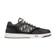 Studio side profile of black Dior B27 low-top leather trainer in black and white