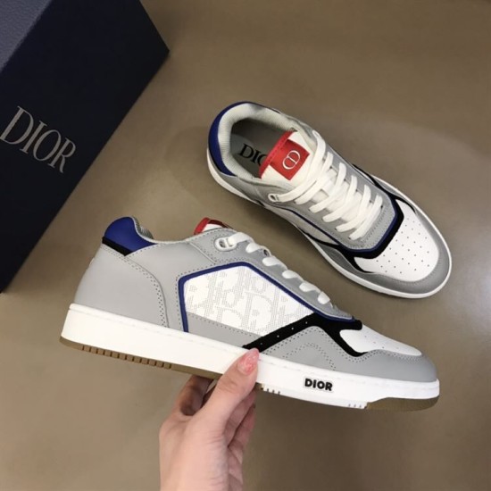Dior B27 Low Top Grey White Canvas Trainer Side Detail Handheld view showing side panel and blue heel tab of Dior B27 trainer in grey and white