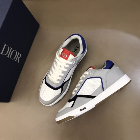 Dior B27 Low Top Grey White Canvas Trainers Angled View Angled top view of Dior B27 Low Top Grey White Canvas Trainers with branded box