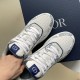 Close-up top view of the lace-up closure and toe box on Dior paisley trainers in white and navy