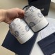 Heel counter detail of white and navy Dior paisley print trainers