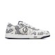Studio side view of Dior B27 white and navy paisley low-top trainer