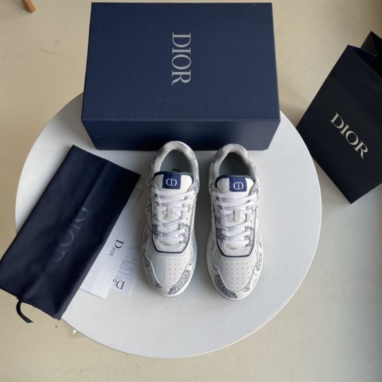 Top-down view of Dior white and navy low-top paisley print trainers
