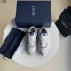 Top-down view of Dior white and navy low-top paisley print trainers