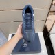 Dior B27 Low-Top Navy Blue Leather Trainer Top View Top view of Dior B27 Low-Top Navy Blue Leather Trainer held in hand