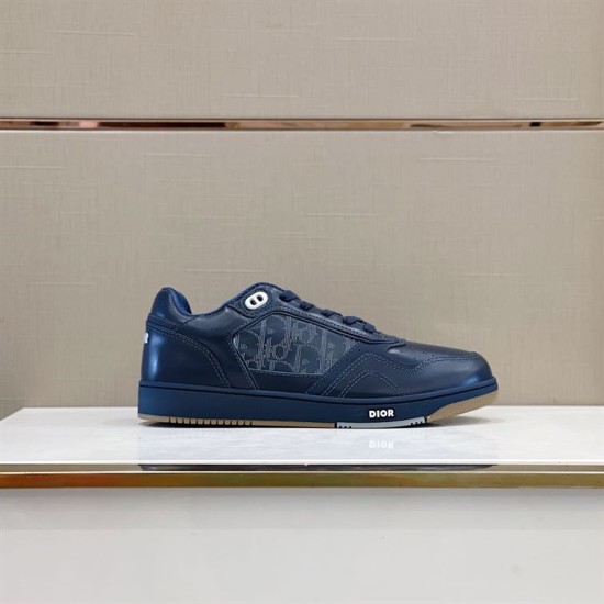 Dior B27 Low-Top Navy Blue Leather Trainers Lateral View Dior B27 Low-Top Navy Blue Leather Trainers side view on white pedestal