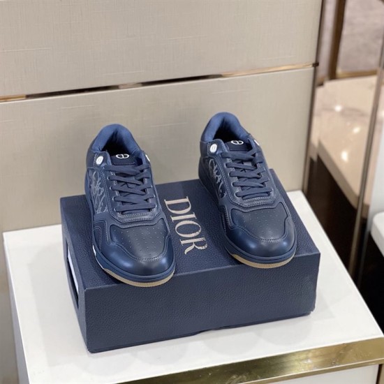 Pair of Dior B27 Low-Top Navy Blue Leather Trainers Pair of Dior B27 Low-Top Navy Blue Leather Trainers set on branded shoebox