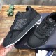 Close-up side perspective of Dior B27 Low-Top Trainers In Black Leather