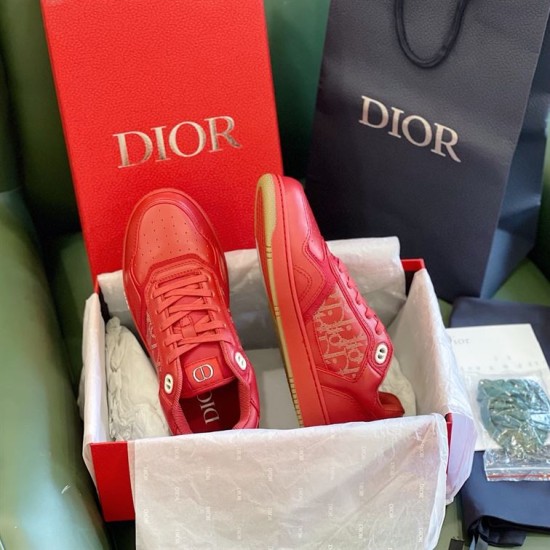 Dior B27 Red Trainers Unboxing Set Dior B27 red low-top trainers presented inside branded packaging box