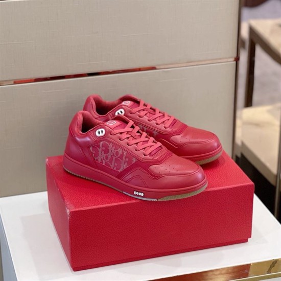 Dior B27 Red Trainers on Box Pair of red Dior B27 low-top trainers resting on red packaging box