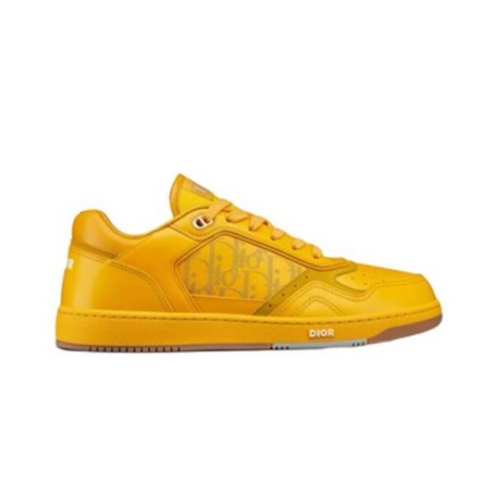 Side profile shot of Dior B27 low-top trainer in yellow leather