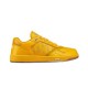 Side profile shot of Dior B27 low-top trainer in yellow leather