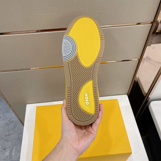 Underside view of yellow Dior B27 trainer sole showing tread pattern