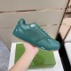 Hand holding green Dior B27 low-top trainer showing side profile and sole edge in green and white