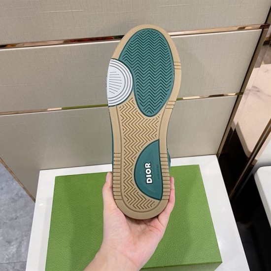 Bottom outsole view of green Dior B27 low-top trainer showing tread and branding in green and white