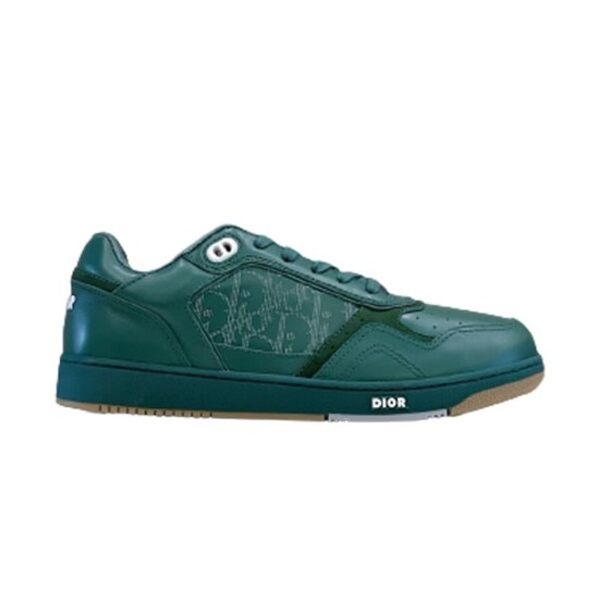 Side profile view of Dior B27 low-top trainer in green leather and canvas on plain white background