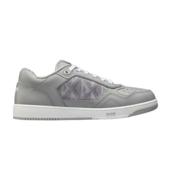 Side profile of the Dior B27 low top grey trainer isolated on white