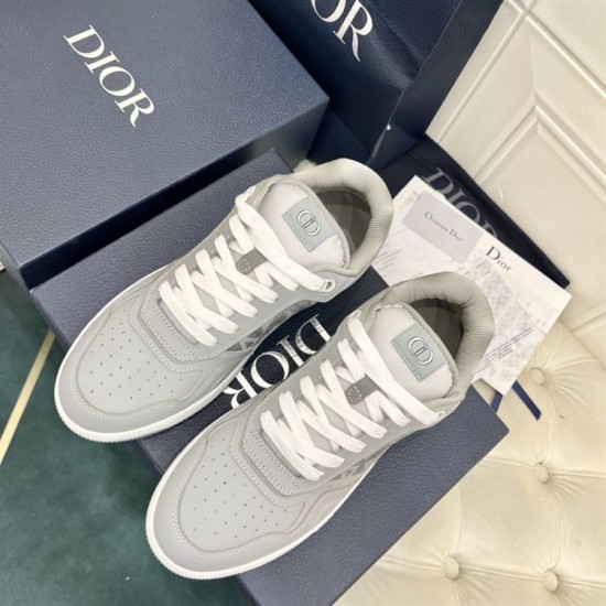 Top-down view of both Dior B27 grey low top trainers with white laces